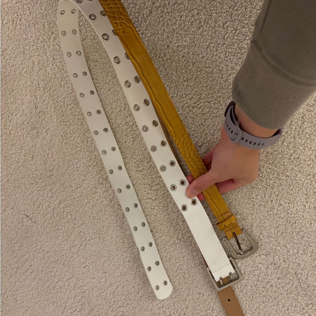 White And Yellow Belts With Silver Buckles